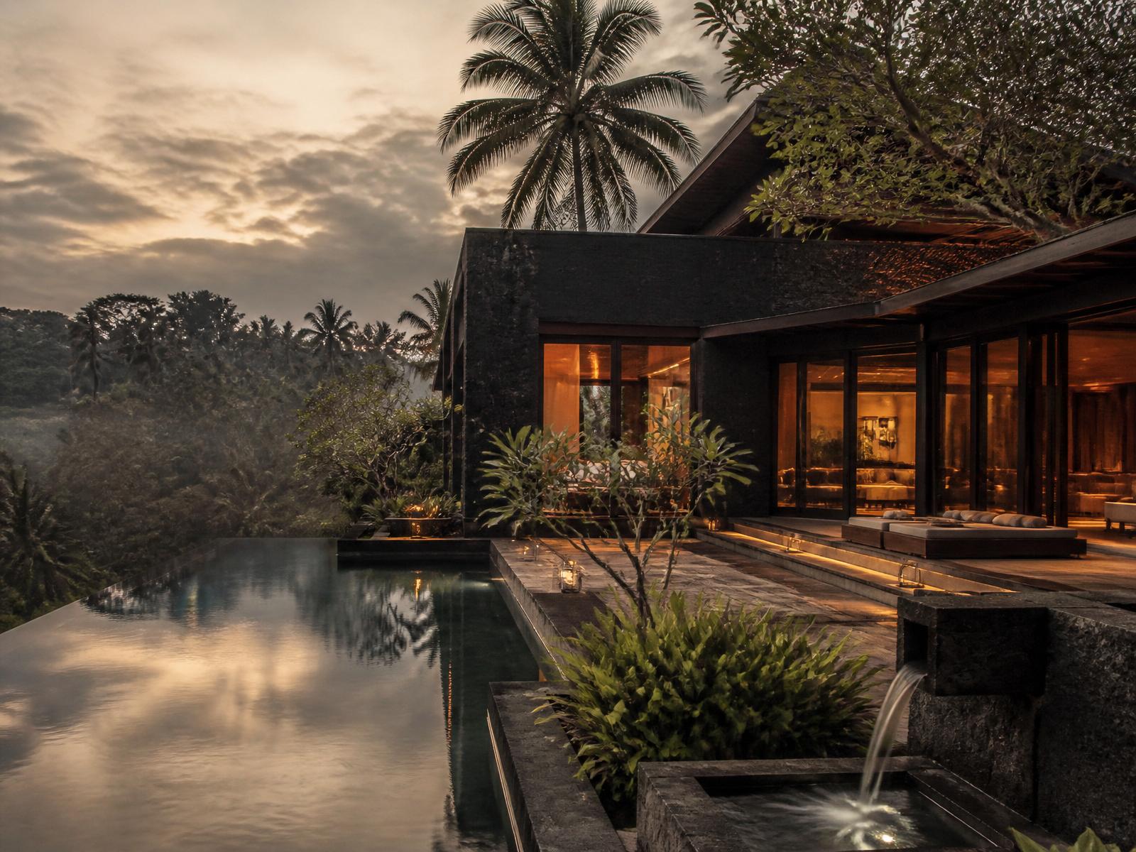 A bespoke residence at dusk, held quietly within its landscape.